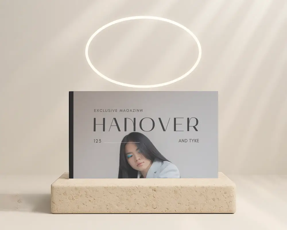 Soft Halo Lit Horizontal Magazine Mockup On Stone Platform Under Minimalist Ring Light Effect In Neutral Studio Setting 0273