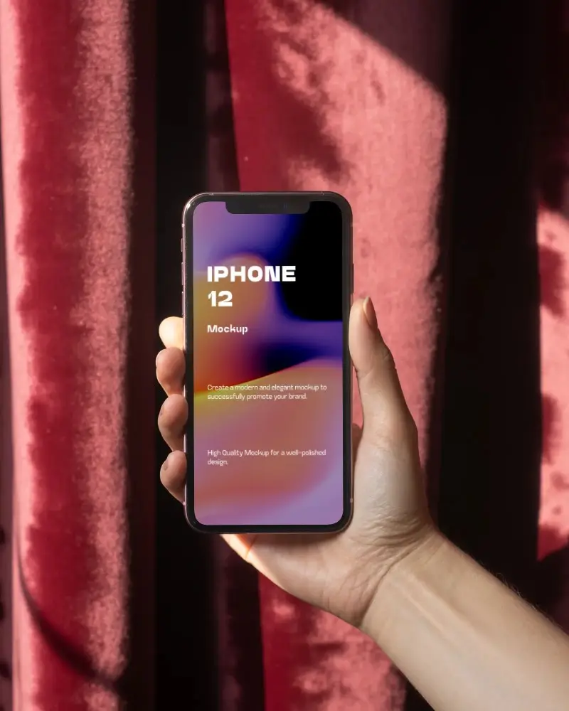 Hand Holding Iphone 12 Mockup With Blank Screen Against Textured Velvet Background