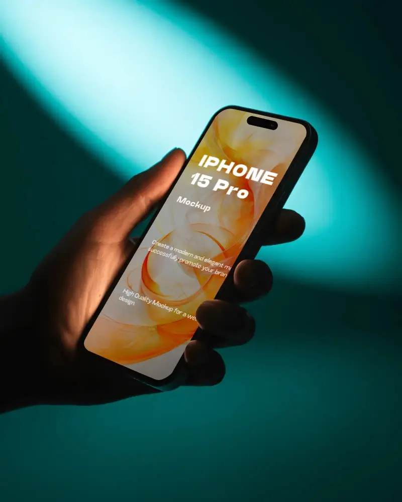 Cinematic Handheld Iphone 15 Pro Mockup Under Teal Directional Lighting In Dark Environment