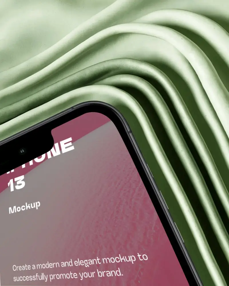 Iphone 13 Mockup Corner Closeup Against Wavy Sage Green Fabric With Luxury Texture Effect