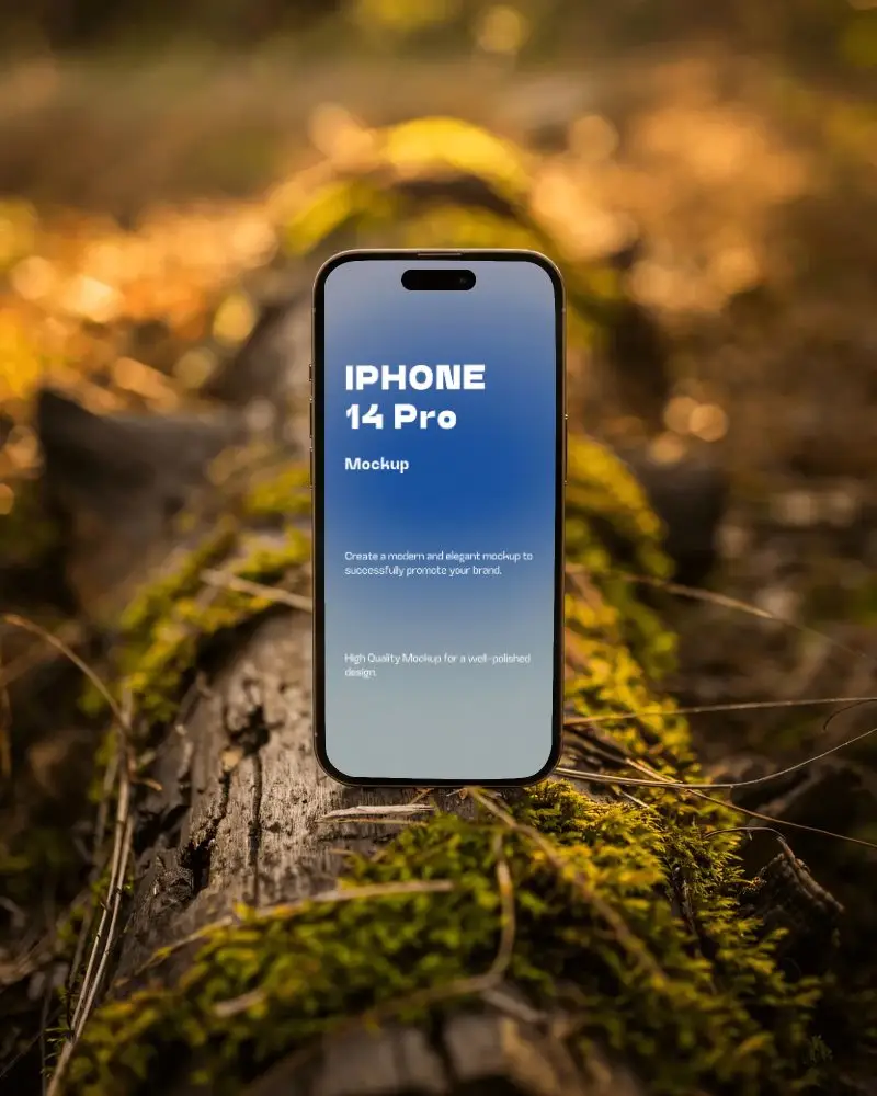 Iphone 14 Pro Mockup Standing On Mossy Log In Golden Forest Light With Natural Bokeh