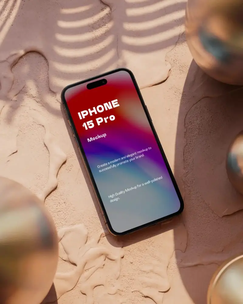 Iphone 15 Pro Mockup On Textured Sand Surface With Metal Spheres And Shadow Play