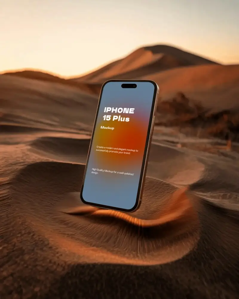 Iphone 15 Plus Mockup Angled Above Sand At Sunset With Soft Golden Hour Lighting