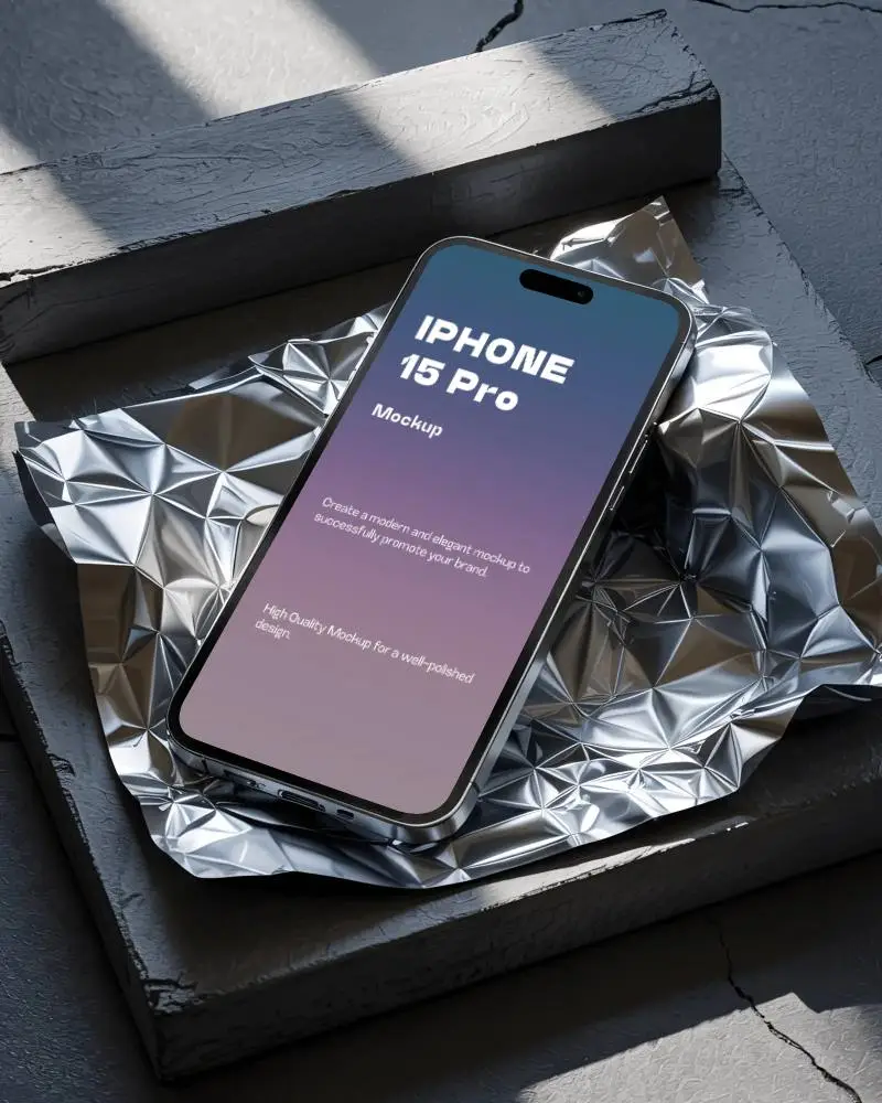 metallic-surface-iphone-15-pro-mockup-on-creased-foil-with-sleek-sculptural-lighting