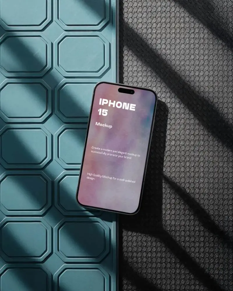 modern-iphone-15-mockup-smartphone-on-textured-surface-with-blue-tiles-and-shadow-light-pattern