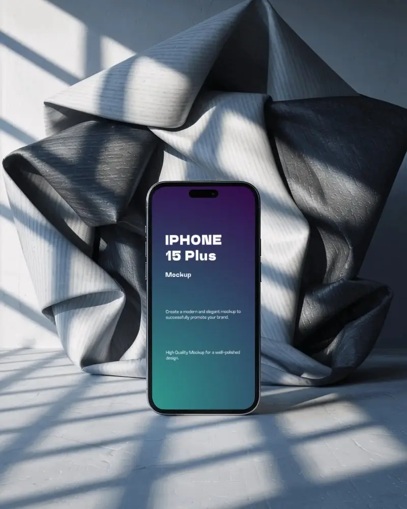 modern-iphone-15-plus-mockup-smartphone-in-studio-scene-with-crumpled-fabric-and-dramatic-shadows
