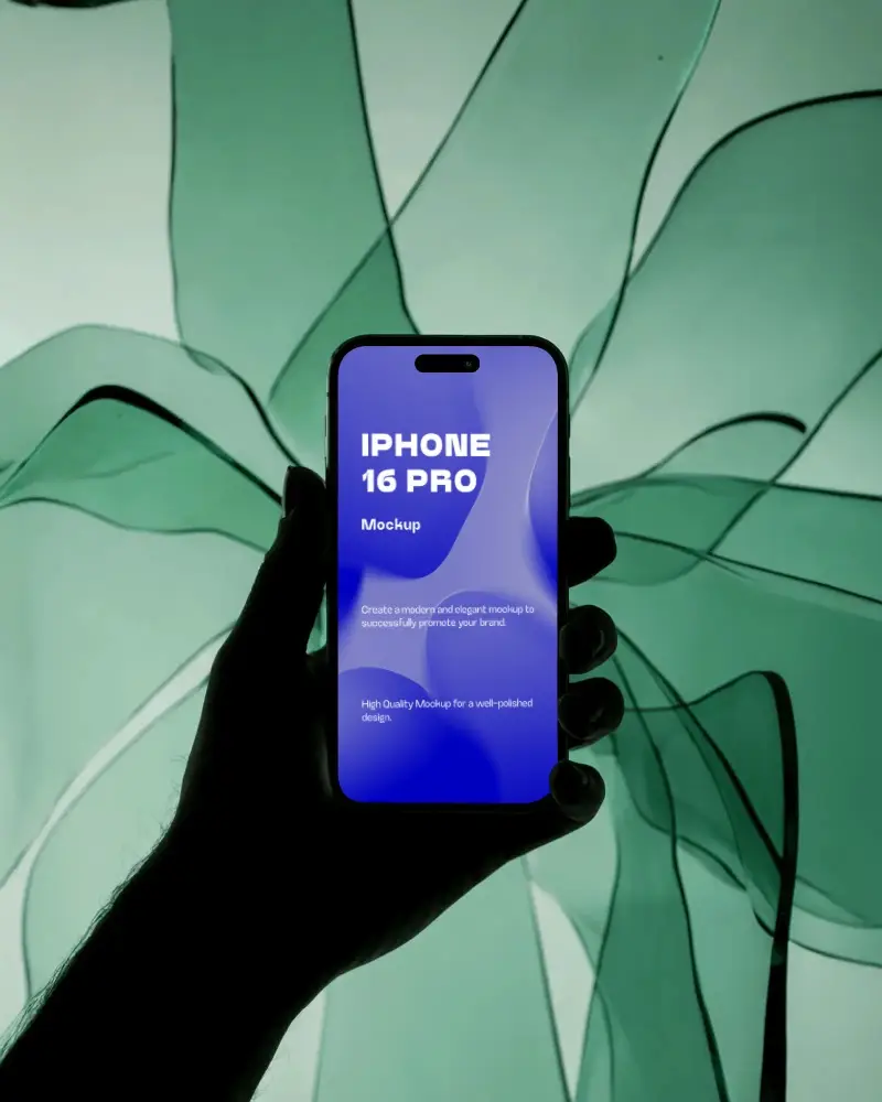 futuristic-iphone-16-pro-mockup-hand-holding-smartphone-against-flowing-green-fabric-light-scene