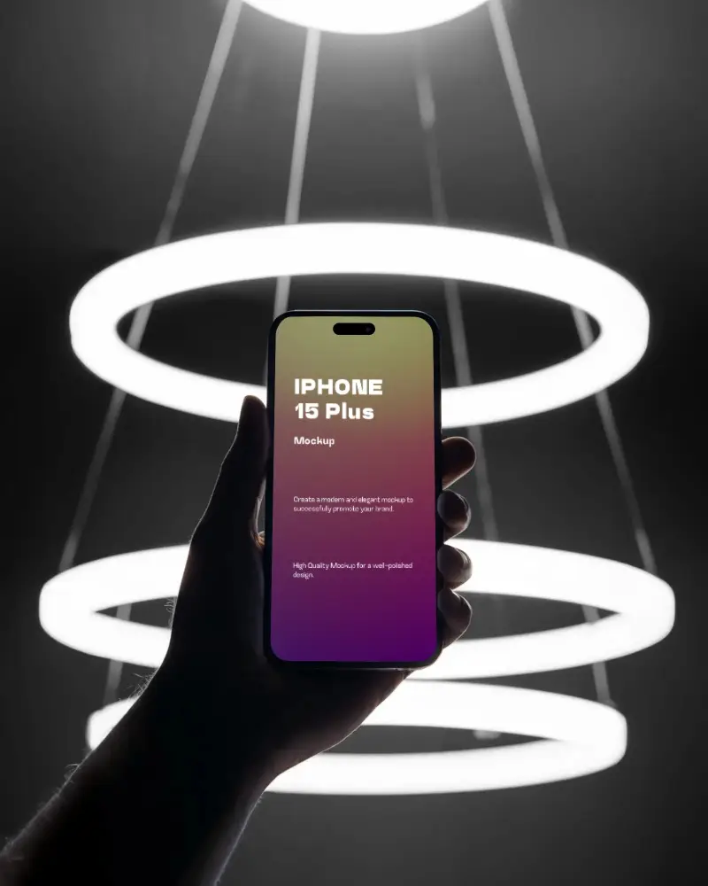 futuristic-iphone-15-plus-mockup-hand-holding-smartphone-against-glowing-ring-lights-in-dark-setting