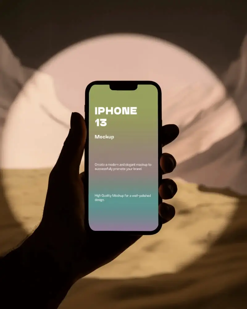 Iphone 13 Mockup Handheld View In Desert Sunset Spotlight Scene With Dramatic Minimal Style