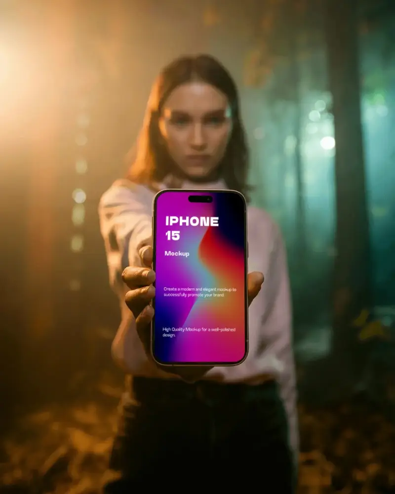 Woman Holding Iphone 15 Mockup In Forest Background Blank Screen Smartphone Display
