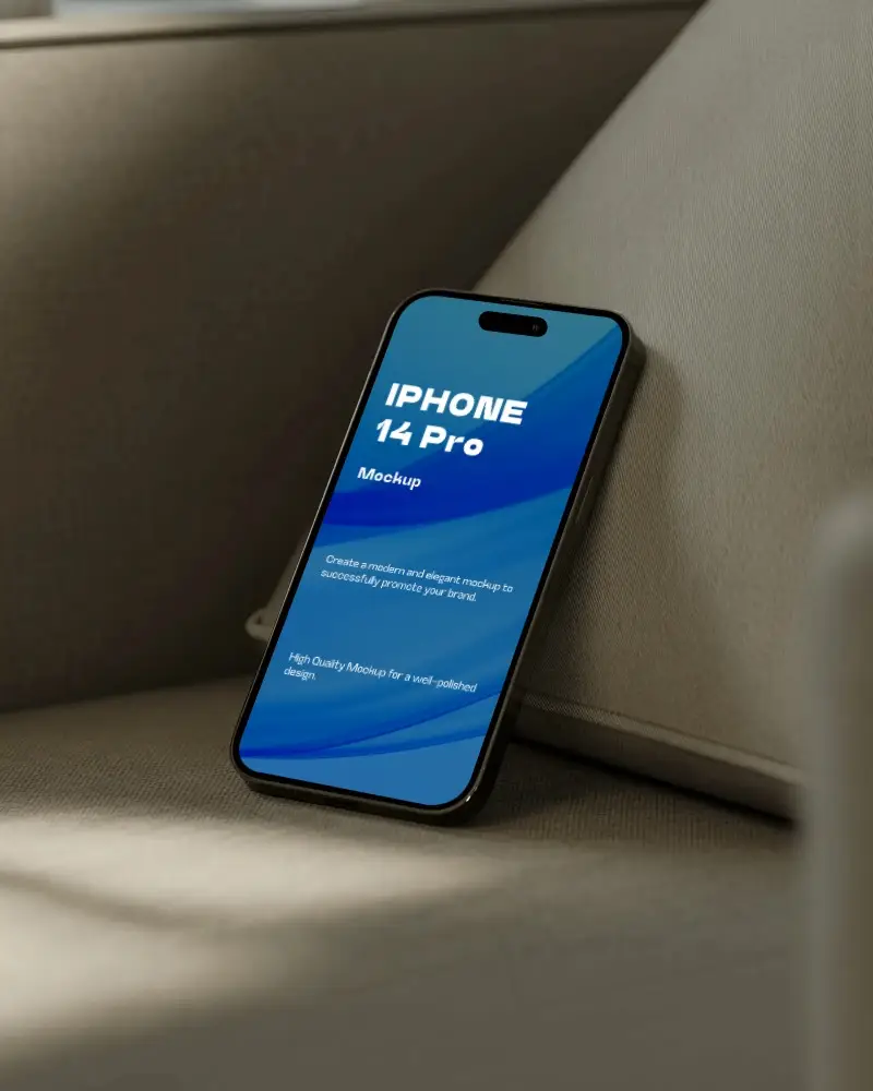 Modern Iphone 14 Pro Mockup Leaning Against Cushion On Luxury Upholstered Furniture Background