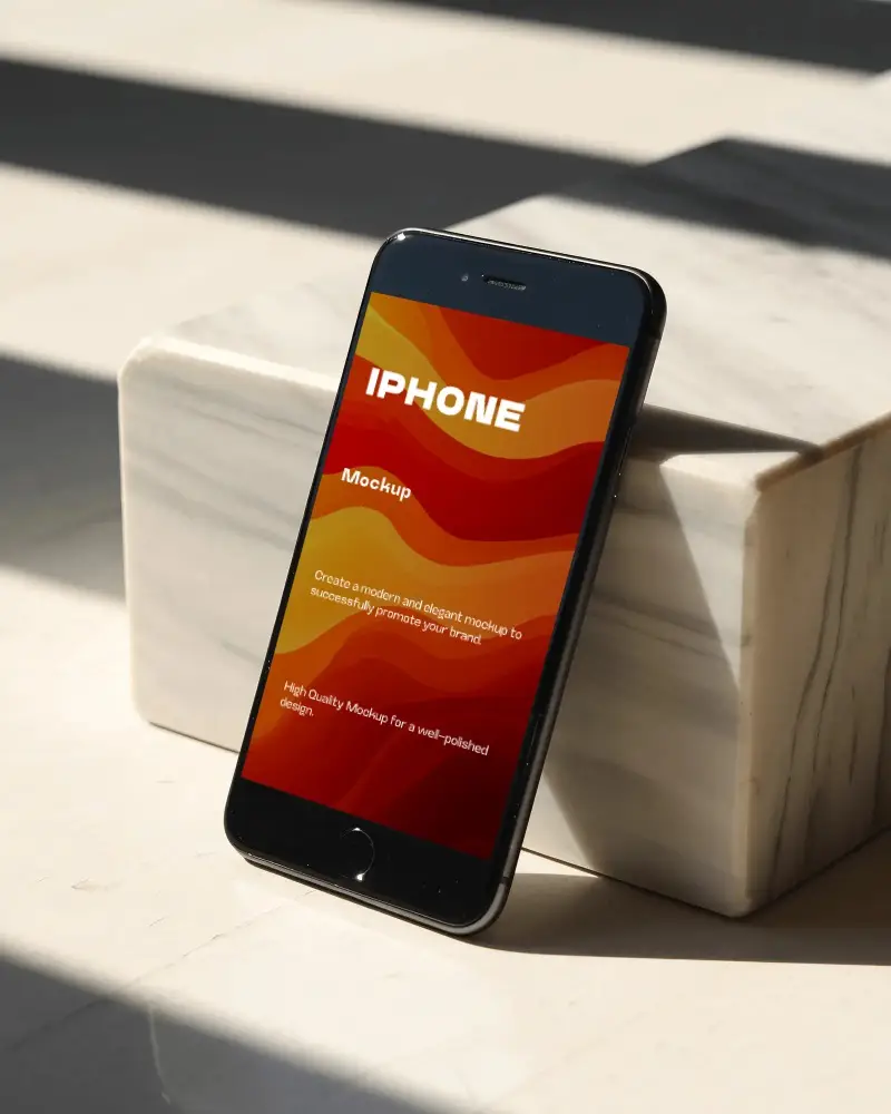 Sleek Iphone 6 Mockup Standing On Marble Surface Capturing Natural Light And Shadow Effect