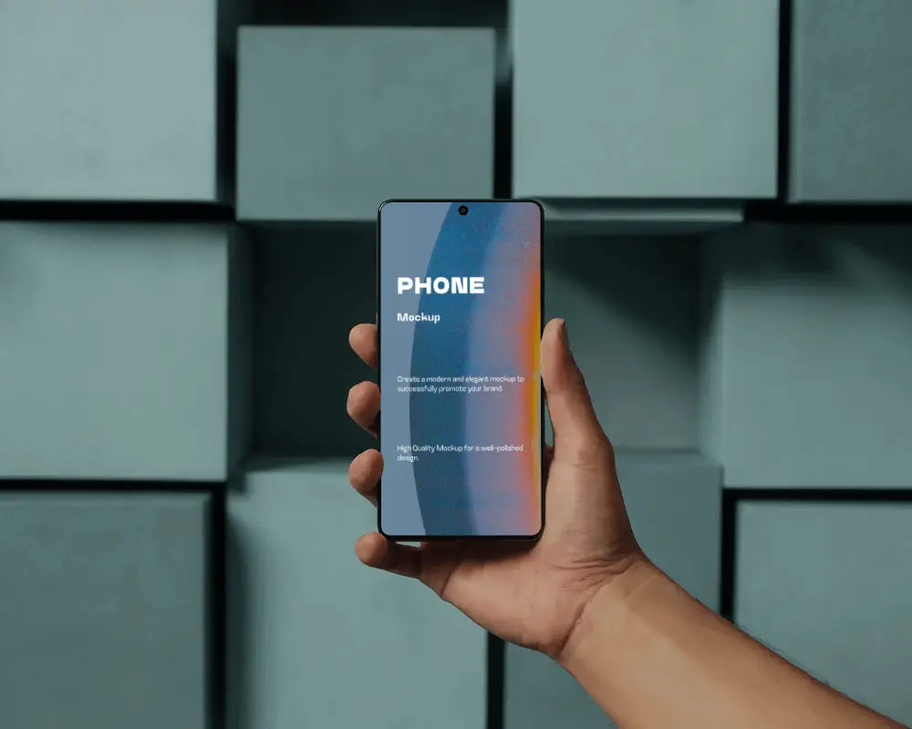 Front Facing Phone Mockup Held In Hand With Architectural Block Backdrop And Soft Shadows