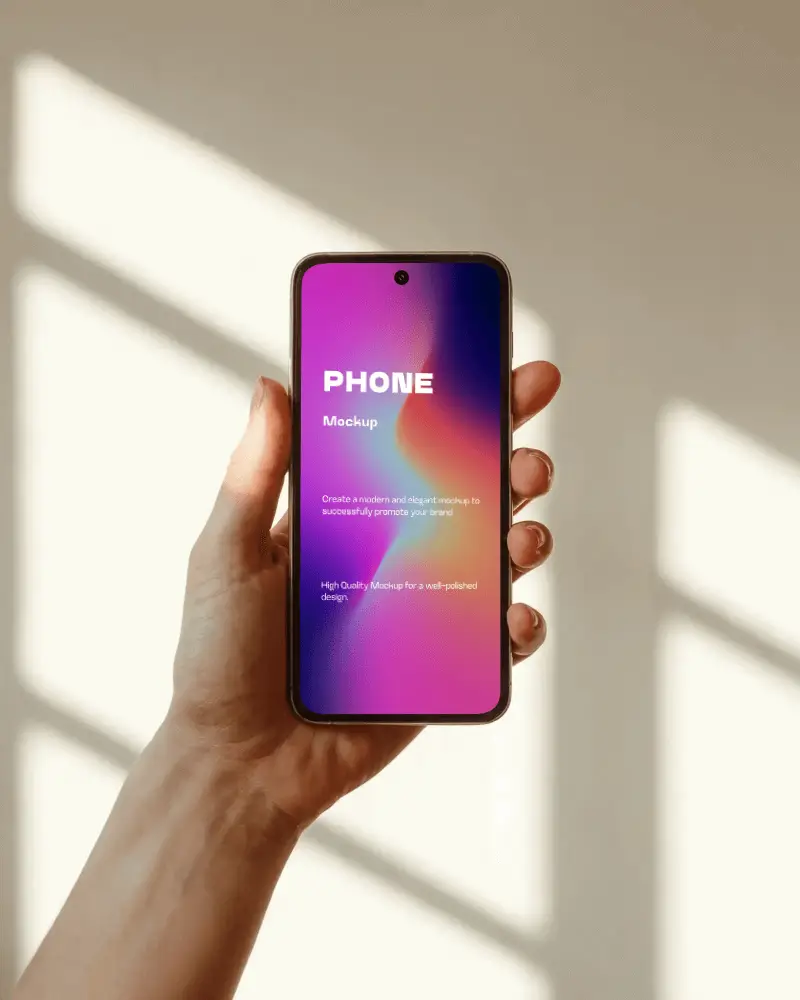 warm-light-phone-mockup-in-hand-with-sunlit-window-shadows-on-neutral-wall-background