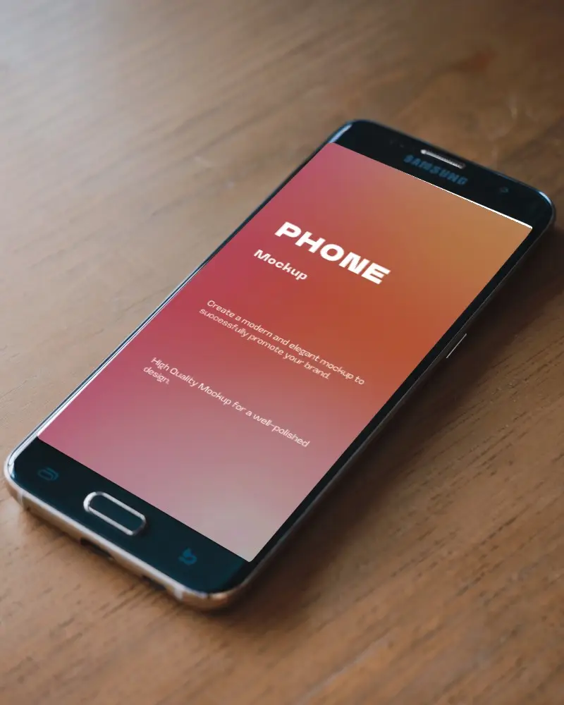 Angled Smartphone Mockup On Wooden Desk Natural Lighting