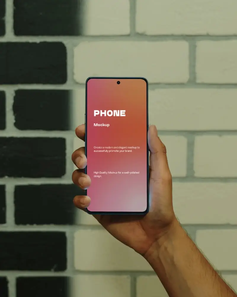realistic-huawei-android-phone-mockup-held-in-hand-against-brick-wall-front-screen-display