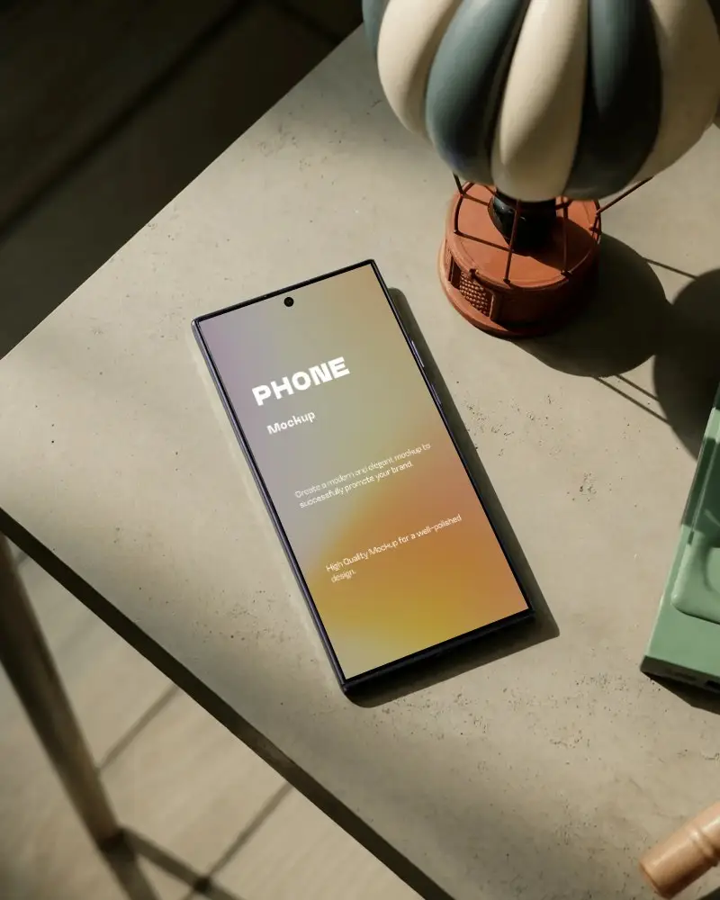 Samsungs25ultra Top View Smartphone Mockup Positioned Next To Decorative Hot Air Balloon Model