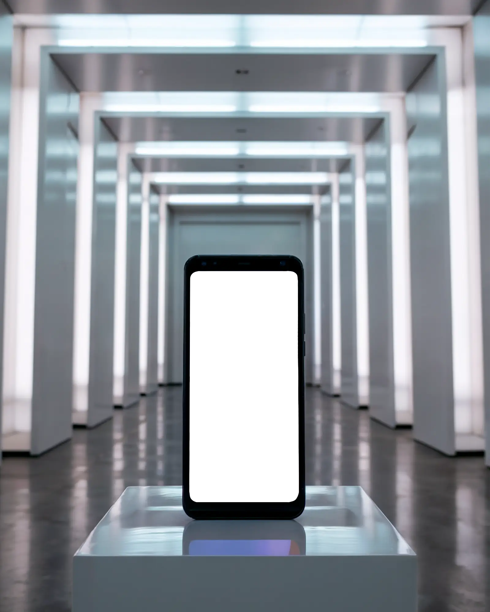Futuristic Gallery Smartphone Mockup Front View On Glossy Pedestal With Led Archway Background High Tech And Immersive Visual Display