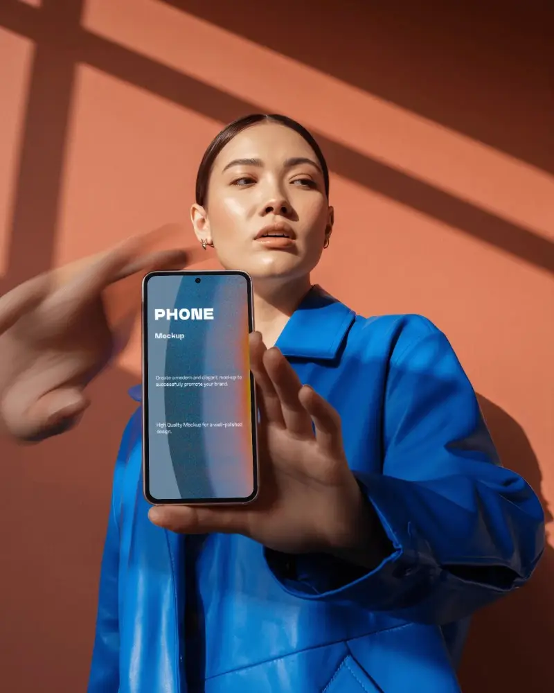 Bold Fashion Google Pixel Smartphone Mockup Female Model Holding Phone With Blue Coat And Dramatic