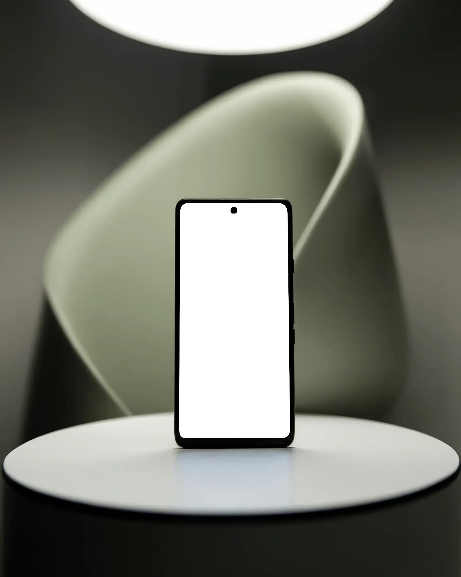 Sleek Smartphone Mockup On Minimal Pedestal Under Soft Spotlight With Modern Sculptural Backdrop Dramatic And Contemporary Aesthetic