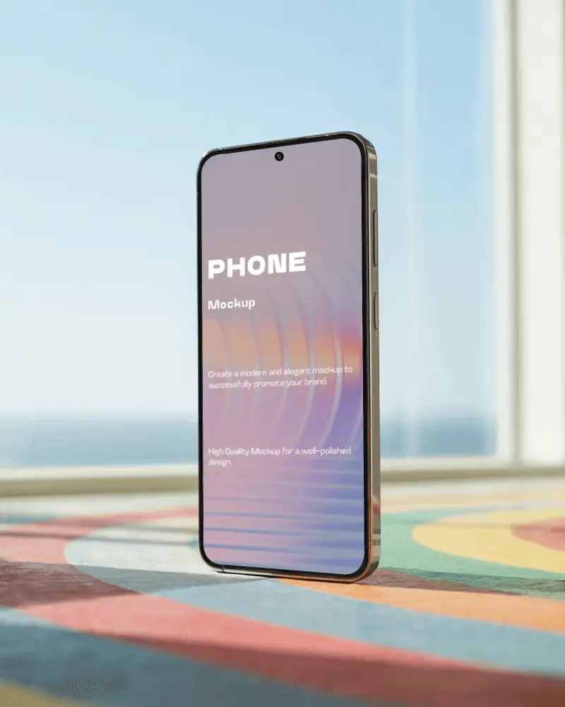 Sleek Minimalist Phone Mockup Standing On Colorful Patterned Table With Sunny Background