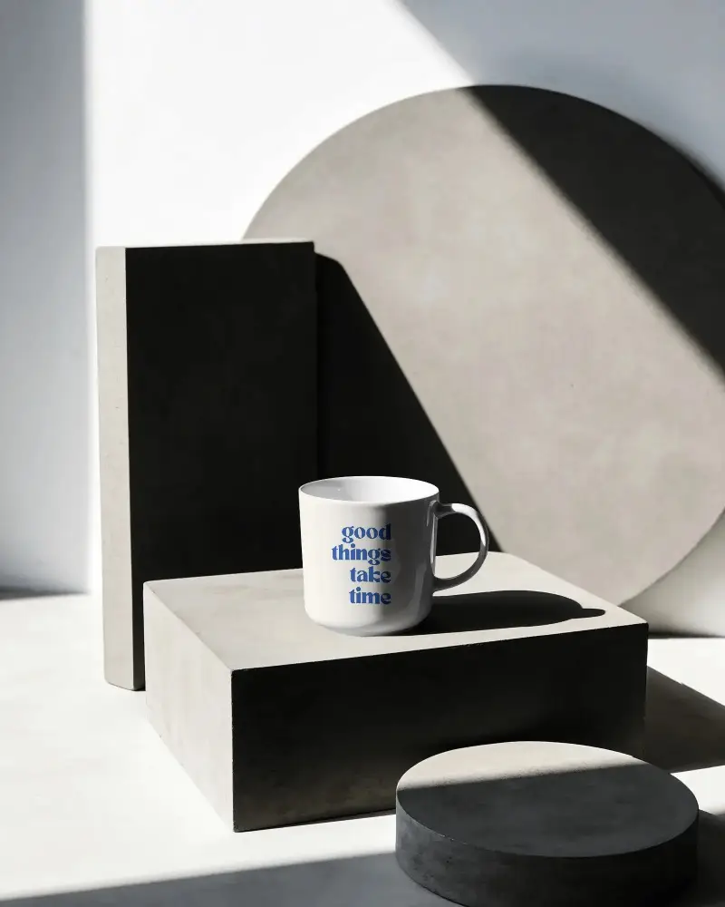 Blank Ceramic Mug Mockup Standing On Textured Concrete Block Shadow Play Background