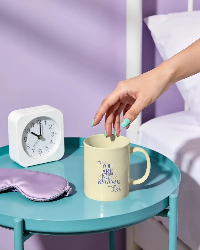 Lifestyle Morning Scene Mug Mockup On Sleek Metal Nightstand With Sleep Mask Accessory