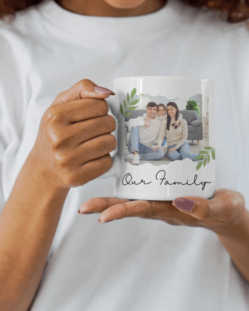 Hand Holding White Mug Mockup In Casual Setting With White Shirt