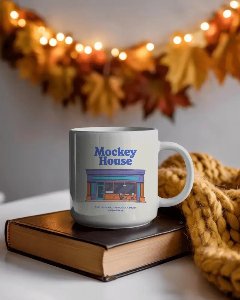 Cozy Fall Morning Mug Mockup With Book And Knit Sweater On Tabletop