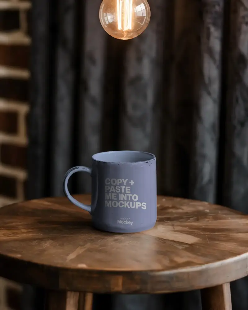 Rustic Coffee Mug Mockup With Wooden Table And Industrial Lighting Setup