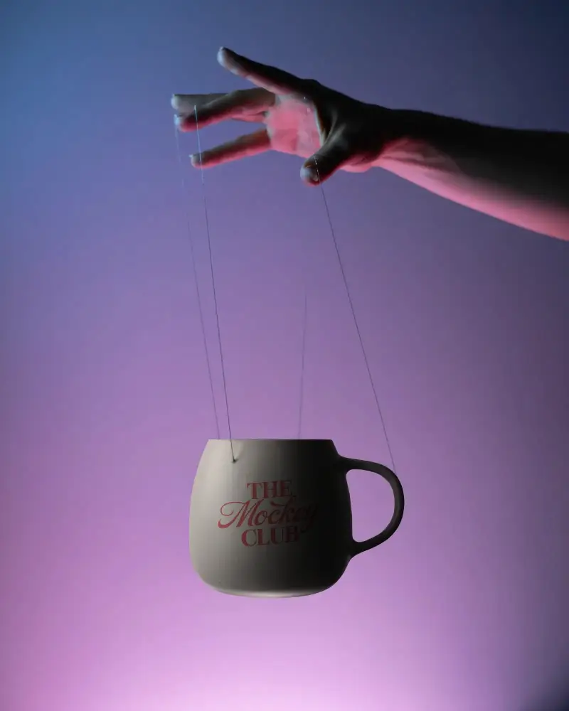 Hand Suspended Mug Mockup With Subtle Shadows For Realistic Product Presentation