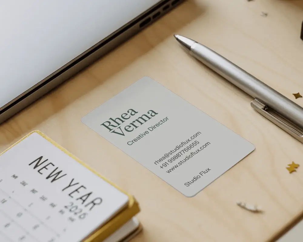 Elegant New Year Planning Station With Minimalist Card Mockup And Pen On Wooden Desk