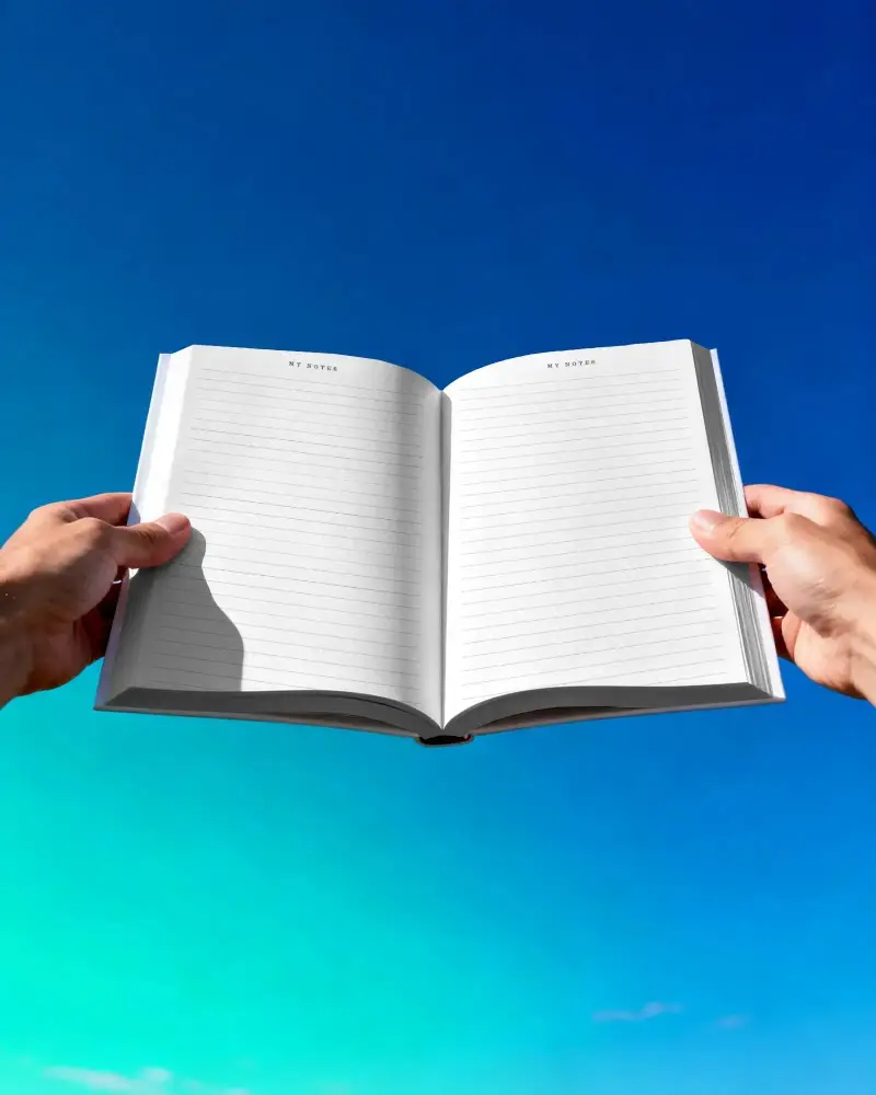 Panoramic View Of Open Notebook Mockup With Blank Spread Facing Reader Outdoors