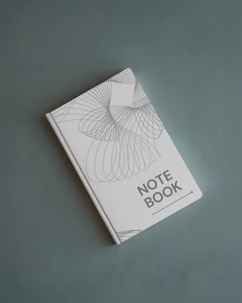 minimal-hardcover-notebook-mockup-top-view-angled-on-muted-blue-surface-clean-and-elegant-stationery-presentation-045