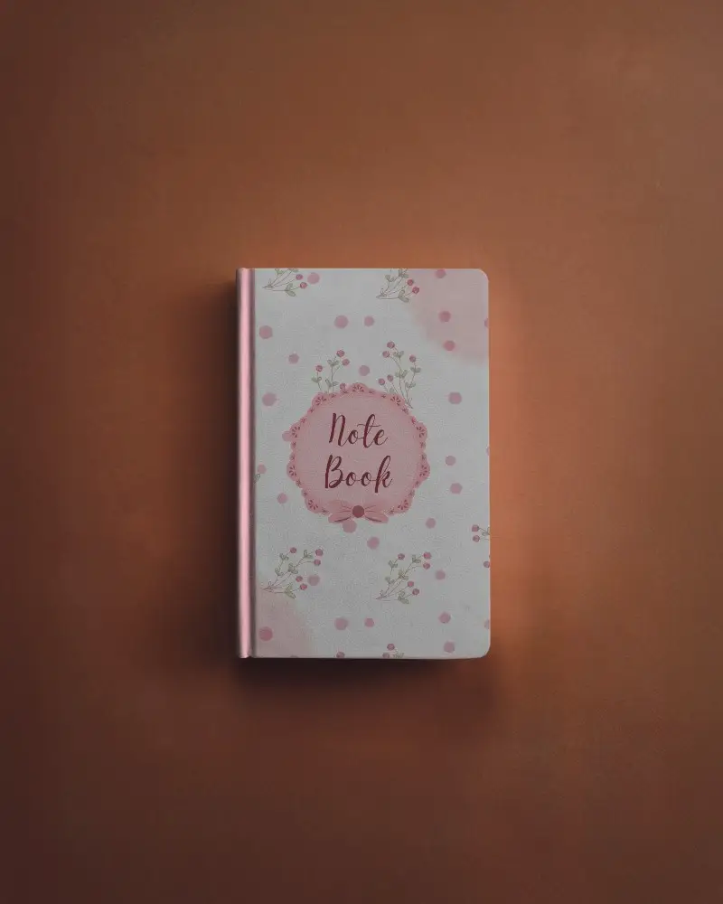front-view-closed-notebook-mockup-on-warm-toned-background-clean-and-elegant-presentation-for-cover-design
