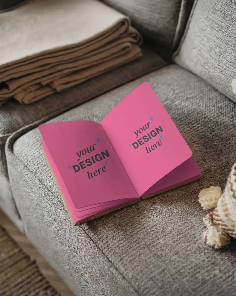 cozy-livingroom-open-notebook-mockup-on-textured-sofa-with-blankets-and-pillow-warm-and-inviting-home-setting-relaxed-and-comfortable-vibe