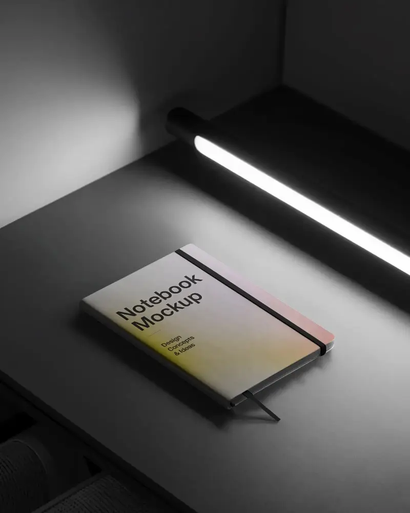 cinematic-office-notebook-mockup-with-strong-shadow-and-table-lamp-lighting-style