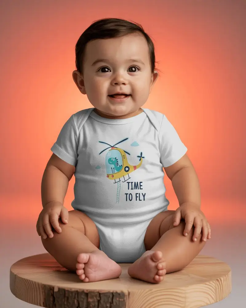 Warm Gradient Baby Onesie Mockup Seated On Wooden Platform In Studio Light