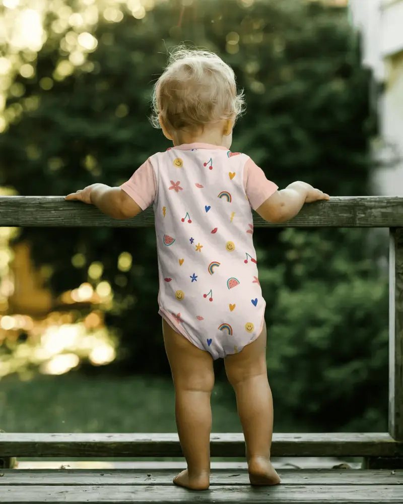 Outdoor Balcony Baby Onesie Mockup Back View Toddler Standing On Deck With Natural Scenic Depth