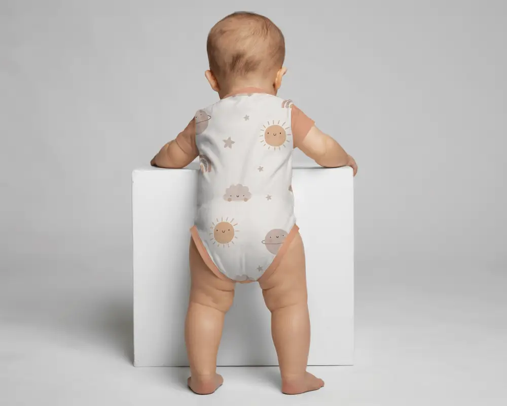 Classic Studio Onesie Mockup Back View Toddler Standing By Cube Block Minimal Light Setting