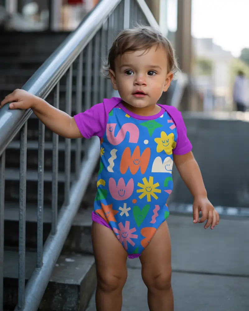 Infant Onesie Apparel Mockup Standing Outdoor Urban Background Casual Wear Closeup Shot