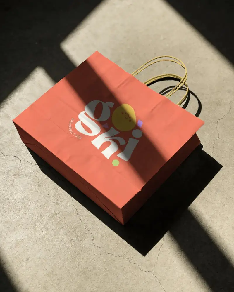 Kraft Paper Shopping Bag Mockup With Twisted Handles Placed On Textured Background For Design