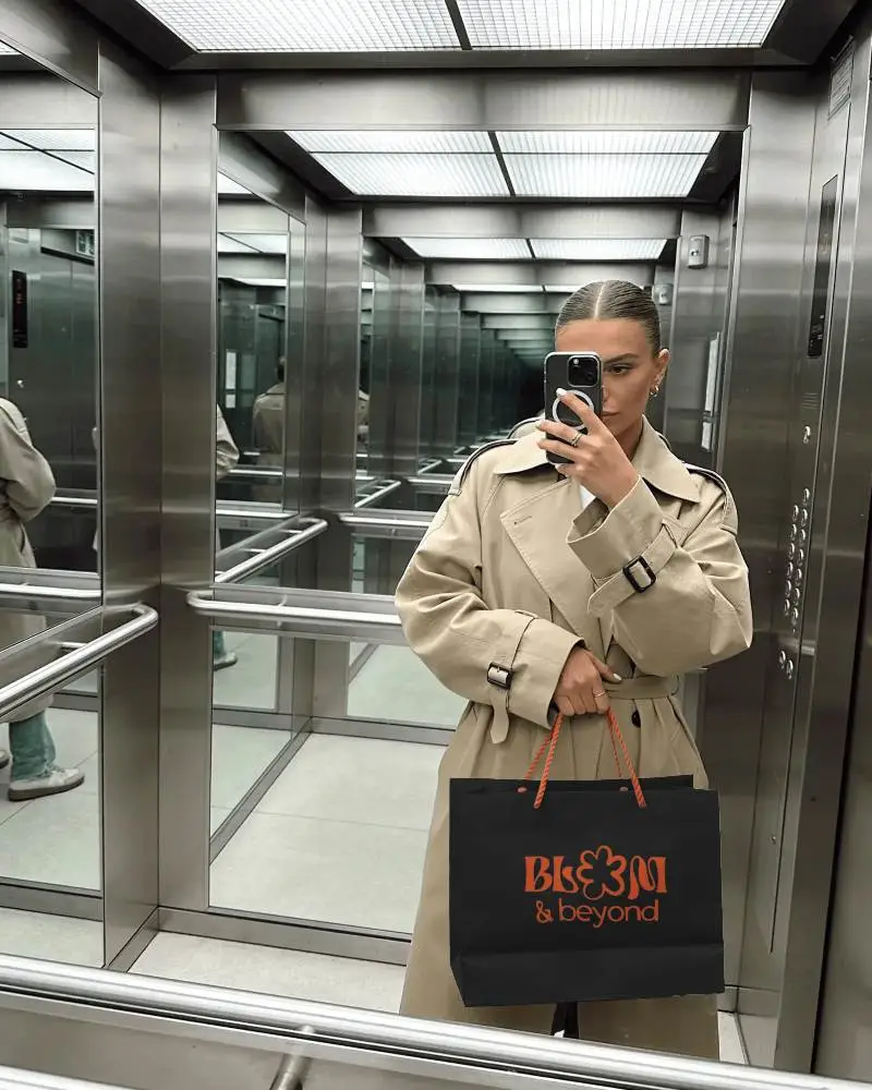 Stylish Paper Bag Mockup In Modern Elevator For Brand Promotion And Visual Presentation