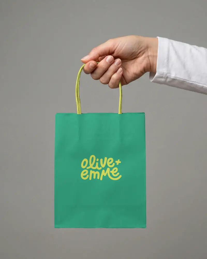 Eco Friendly Paper Bag Mockup In Hand With Twisted Handle Perfect For Branding And Packaging