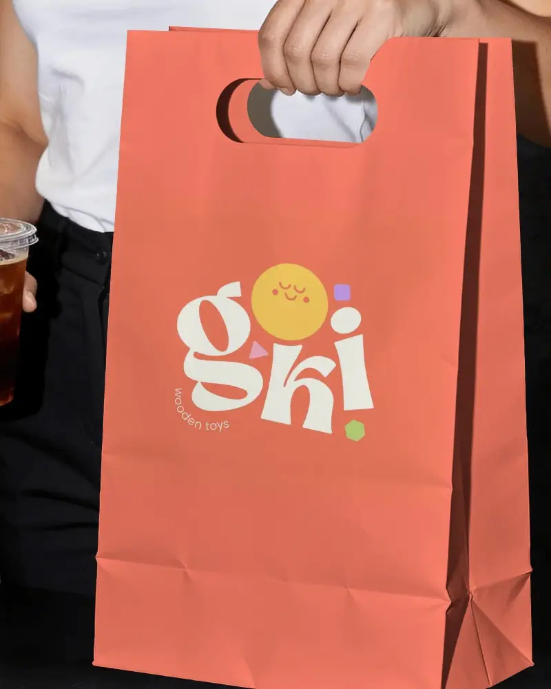 Ecofriendly Paper Gift Bag Mockup With Die Cut Handle For Retail And Cafe Packaging