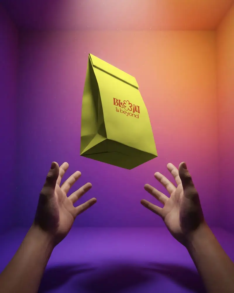 Premium Eco Friendly Paper Bag Mockup Floating Between Hands In Vibrant Gradient Box Background