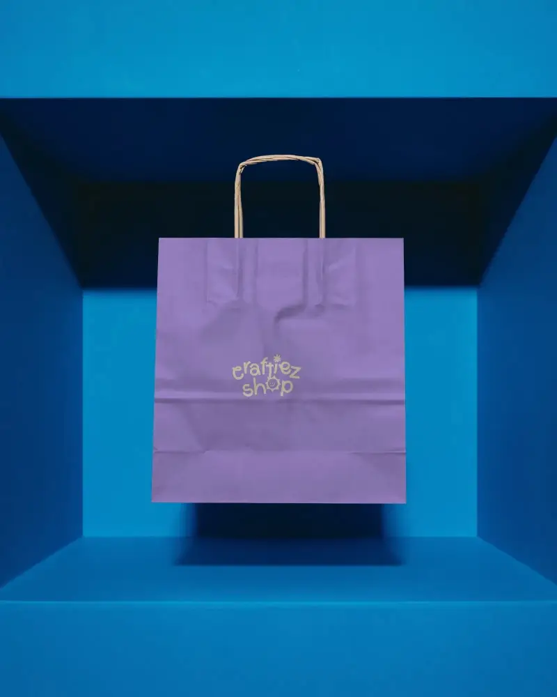 Eco Friendly Paper Bag Mockup With Twisted Handle Floating In Minimalist Blue Box Background