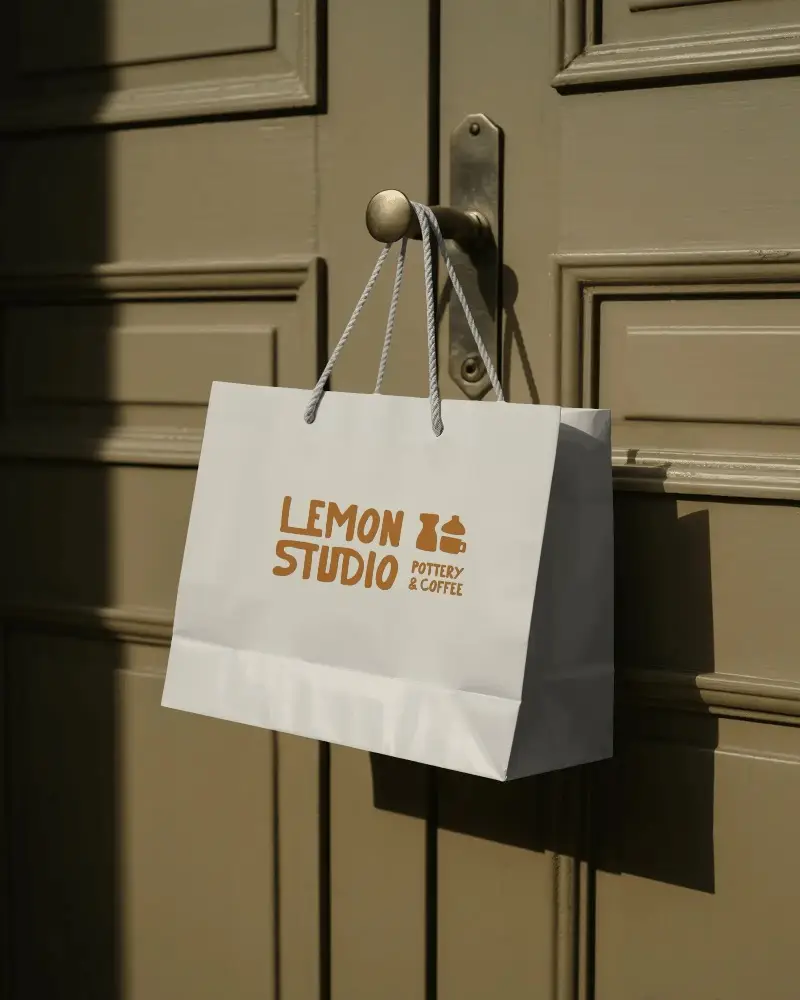 Eco Friendly Paper Bag Mockup With Rope Handles Hanging On Textured Door For Branding