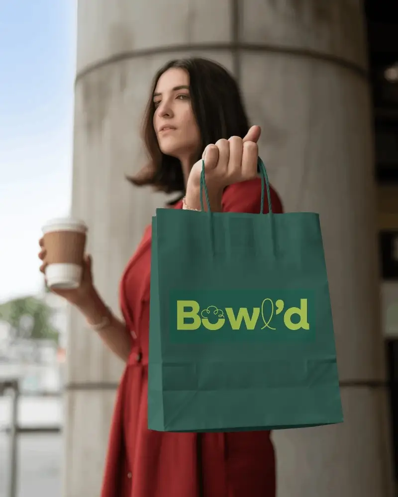 Blank Paper Bag Mockup Held By Female Model For Brand Marketing Purposes