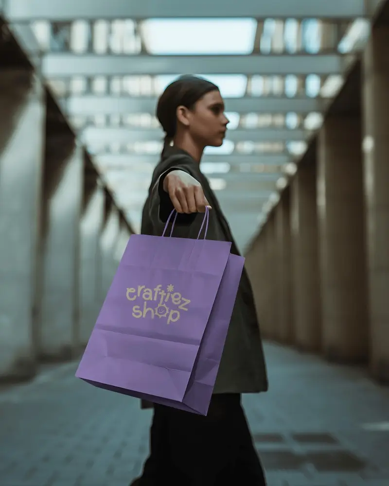 Shopping Paper Bag Mockup Handheld By Model In Modern Architectural Corridor